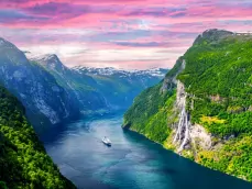 Panorama of breathtaking view of Sunnylvsfjorden fjord and famous Seven Sisters waterfalls, near Geiranger village in western Norway.